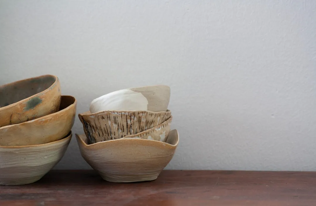 A group of bowls sitting on top of a wooden table