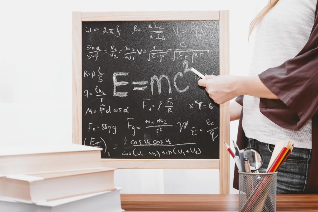 E=mc2 written on chalkboard