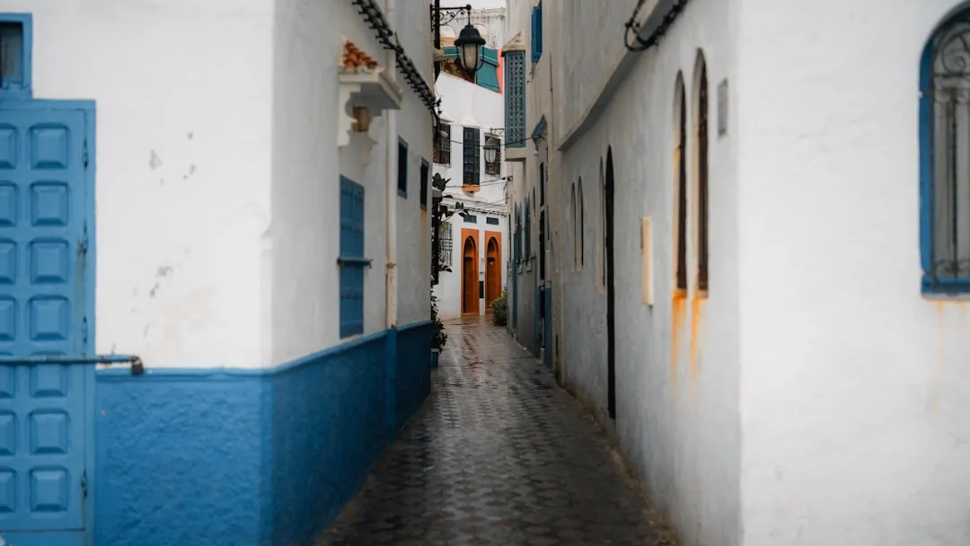 Narrow street with white and blue buildings